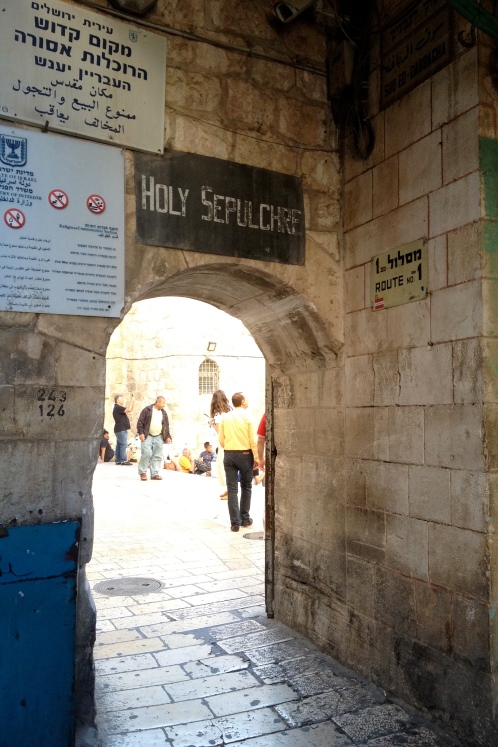 Sign over an arch outside the Holy Sepulchre's courtyard