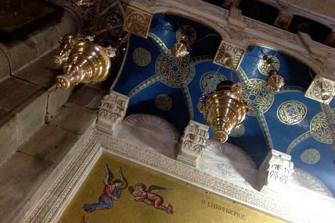 Hanging lanterns inside the church, above the mosaic